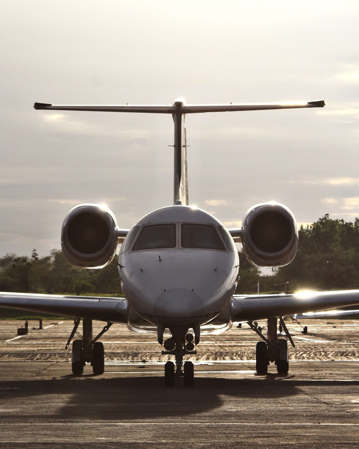 A private jet on the ramp in warm evening light